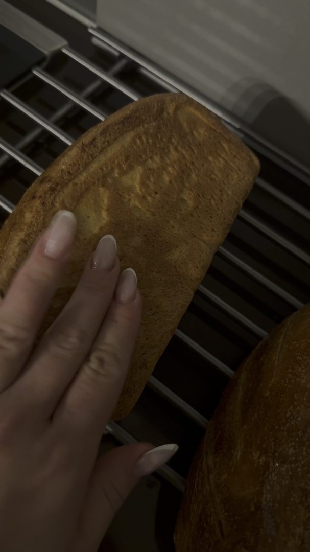 Checking baked sourdough loaf for the 200C hollow knock
